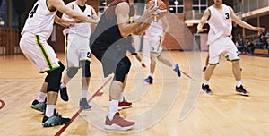 Basketball Players in Action. High School Basketball Team Playing Game