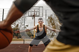 Basketball players, outdoor court, active leisure