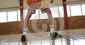 Basketball players practicing dribbling drill