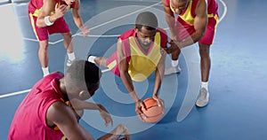 Basketball players strategize on the court