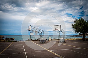 Basketball playground by the sea in autumn