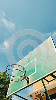 Basketball ring in the middle of a scorching midday photo