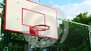 Basketball ring. Scene basketball ring on the street close-up, the net sways in the wind. Sport, basketball.