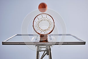 Basketball, shooting ball and target of outdoor sports goals, competition game and action on sky background. Background