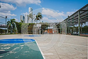 Basketball and soccer court outdoor with city background