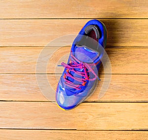 Basketball Sport shoes or sneakers on wooden board