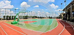 Basketball stadium playground with blue cloudy sky