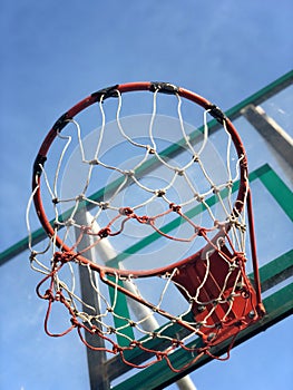 Basketball street court on blue sky background