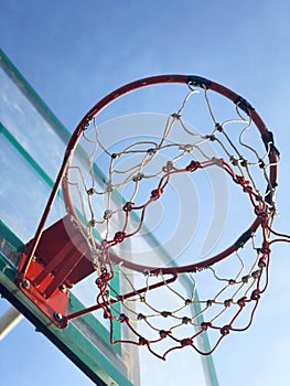 Basketball street court on blue sky background