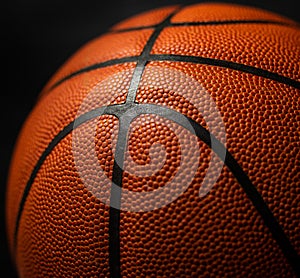 Basketball under the light with a black background