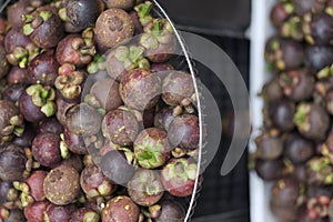 Baskets with fresh exotic tropical fruit mangosteen