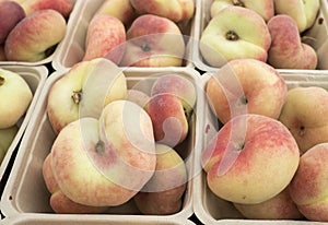 Baskets of Fresh Saturn Donut Peaches