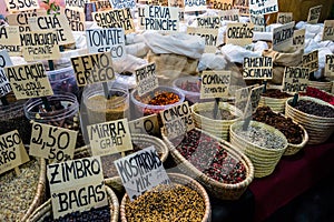 Baskets of spices at stall in street market