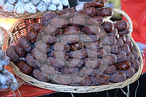 Baskets topped with dry sausages for charcuterie presentation