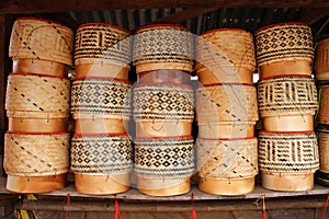 basketware and wicker items stall in a village in laos
