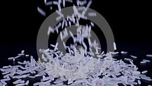 Basmati white rice falling on a black background