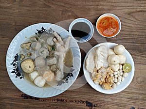Baso Aci, a soupy food consisting of meatballs, various crackers, chicken claws. photo
