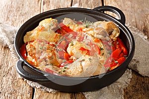 Basque Chicken or Poulet Basquaise with vegetables close up in the pan. Horizontal photo