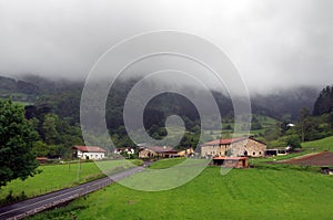 Basque country village with typically basque houses and rainy we photo