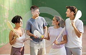 Basque pelota players chatting on outdoor fronton photo