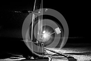 The bass drum pedal in low light background, balck and white.