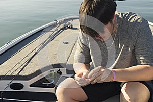 Bass fishing in bass boat on the lake