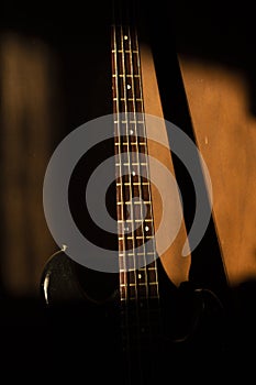 Bass guitar in music studio shot at golden hour