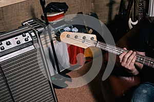 Bass guitar riff in studio closeup