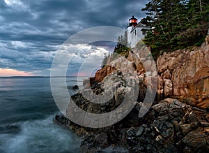 Bass Harbor Lighthouse and stormclouds at dusk