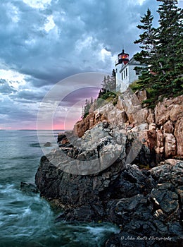 Bass Harbor Lighthouse and stormclouds at dusk