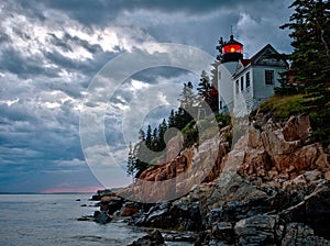 Bass Harbor Lighthouse and stormclouds at dusk