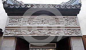 Bass-relief plaque on the doorway of the house in the Grand Canal, ancient town of Yuehe in Jiaxing, China