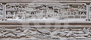 Bass-relief plaque on the doorway of the house in the Grand Canal, ancient town of Yuehe in Jiaxing, Zhejiang Province, China