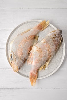 BASS ON A WHITE PLATE