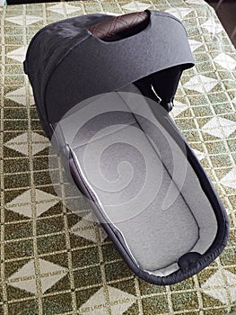 A bassinet from a stroller in a separate room