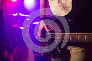 Bassist playing the bass on stage for background, live music, live event, music around the world