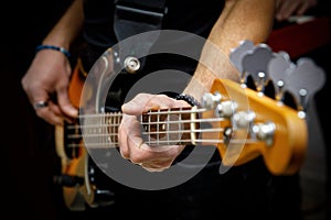 Bassist playing electric bass guitar.