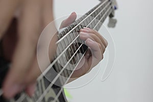 Bassist`s fingers with white background