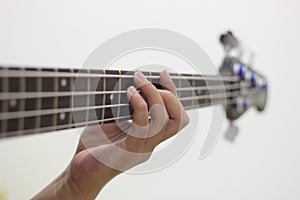 Bassist`s fingers with white background