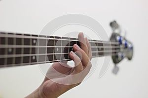 Bassist`s fingers with white background