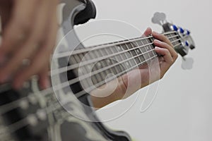 Bassist`s fingers with white background