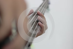 Bassist`s fingers with white background