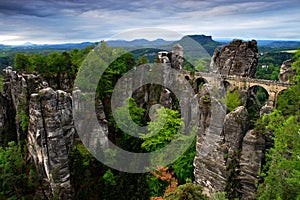 Bastei bridge in Saxon Switzerland, at sunrise and the mist over the river Elbe, National park Saxon Switzerland. Beautiful German