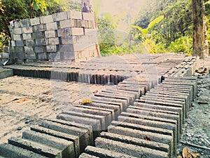 Batako, hard brick made of sand and cement that is printed with traditional tools. photo