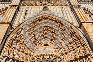 Batalha, Portugal. Close-up of the tympanum, archivolts and lintel of the Portal of Batalha Abbey aka Monastery of Santa Maria da