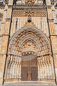 Batalha, Portugal. Portal of Batalha Abbey aka Monastery of Santa Maria da Vitoria, with tympanum, archivolts and lintel and other photo