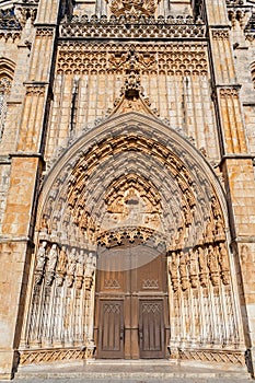 Batalha, Portugal. Portal of Batalha Abbey aka Monastery of Santa Maria da Vitoria, with tympanum, archivolts and lintel and other