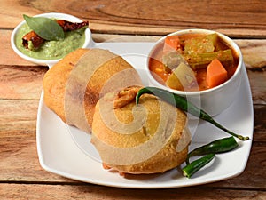 Batata Vada or Potato Fritter is a popular snack in Maharashtra,India. mashed potato patty coated with chick pea flour, which is