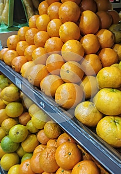 Batch of lime oranges in a supermarket gondole in Sao Paulo city, Brazil.