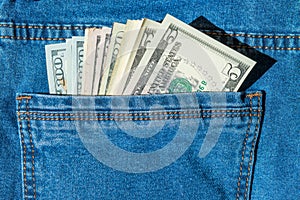Batch of money in blue jeans pocket